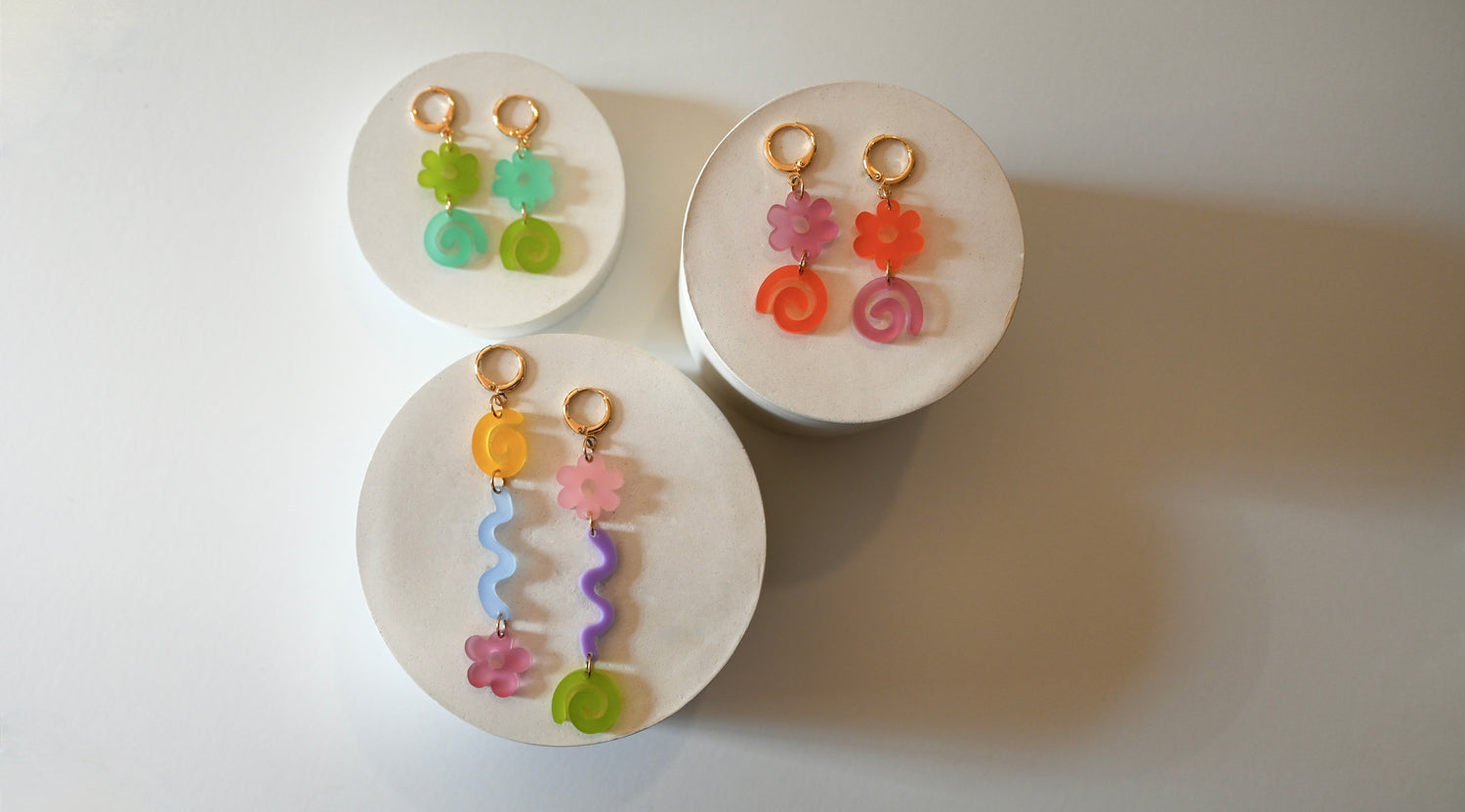 3 pairs of colorful maximalist earrings by jewelry brand Shape and Color