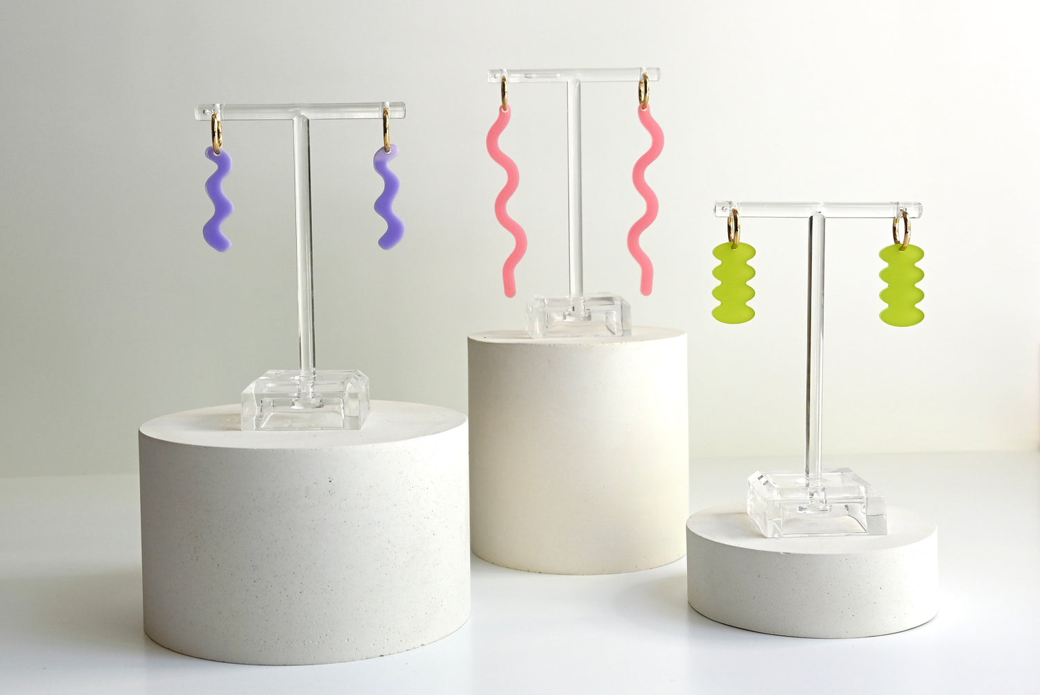 3 pairs of colorful squiggle earrings by jewelry brand Shape and Color